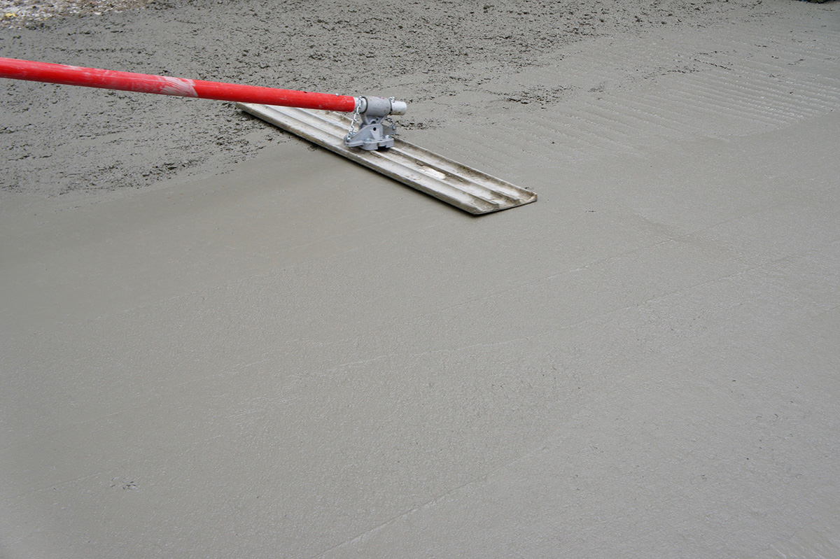 Concrete Work-1009641366 Smoothing newly poured concrete